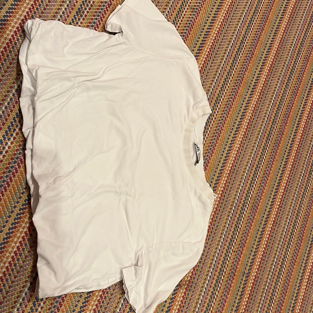 This is a woman’s small shirt from Zara. It is white it is so cute